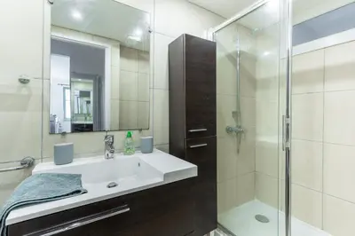 a bathroom with a sink and a shower at Happyfew Cathedrale in Nice