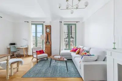 a white living room with a couch and a table at Happyfew Cathedrale in Nice