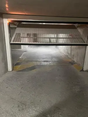 an empty empty parking garage with a metal object at Appartement rénové , Climatisé, Terrasse, Parking en sous sol in Saint-Laurent-du-Var