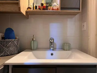 a kitchen sink with two vases on top of it at Lovely apartment nice in Nice