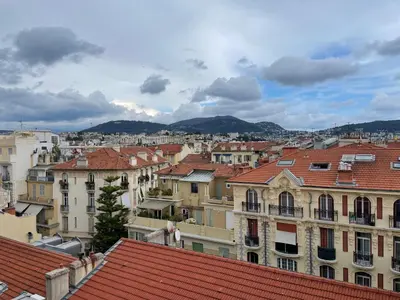 a view of the roofs of a city at Charming Riviera Top-Floor Apartment near the Beach in Nice
