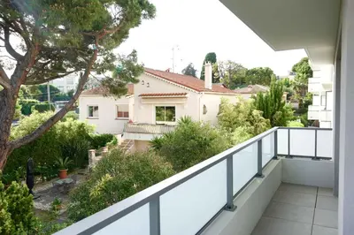 a balcony with a view of a house at Sea view apartment close to beaches in Cagnes-sur-Mer