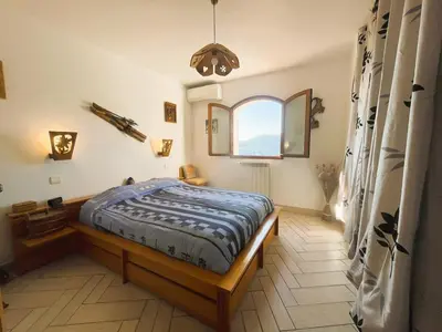 a bedroom with a bed and a window at Maison Familiale 3 chambres Cœur de la Nature in Drap
