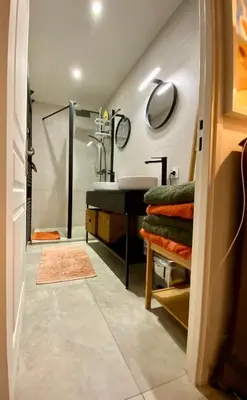 a bathroom with a sink and a shower at Au cœur du Vieux Nice, 3 chambres au calme, grand appartement in Nice