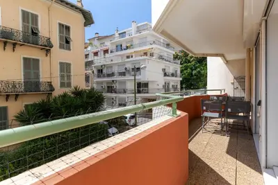 a balcony with a view of some buildings at HAPPYFEW Le Palais des Arts in Nice