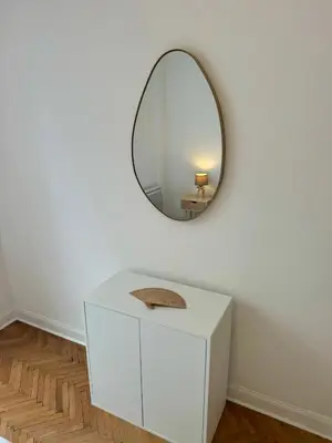 a white dressing table with a mirror on a wall at Cosy appartement gare du sud - Nice - 3 guests in Nice
