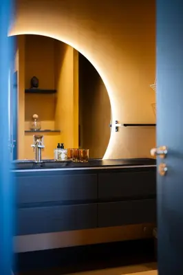 a kitchen with a sink and a mirror at La Fenêtre sur Mer - Superbe Vue Sur Le Port in Nice