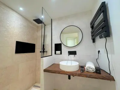 a bathroom with a sink and a mirror at ⁂ Studio Vieux-Nice climatisé: charme commodités in Nice