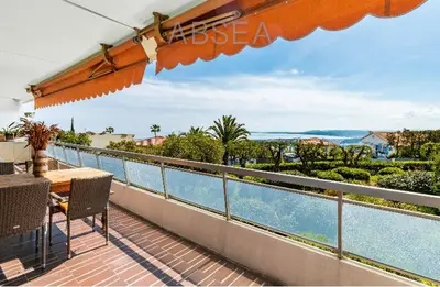 a balcony with a table and a view of the water at Nice Absea Belles Terres 1' in Nice