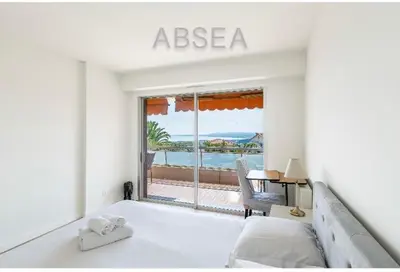 a bedroom with a bed and a view of the ocean at Nice Absea Belles Terres 1' in Nice
