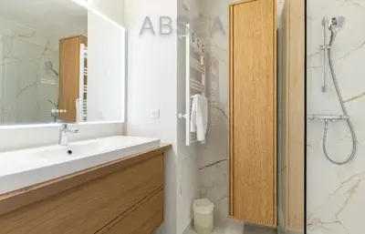 a white bathroom with a sink and a shower at Nice Absea Belles Terres 1' in Nice