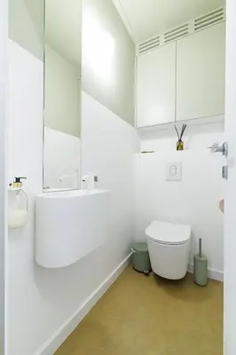 a white bathroom with a sink and a toilet at BERLIOZ - Splendid apartment in Nice city center in Nice