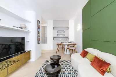 a living room with a couch and a fireplace at BERLIOZ - Splendid apartment in Nice city center in Nice
