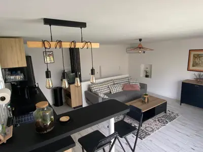 a living room with a couch and a table at Chez Valentine in Nice
