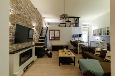 a living room with a couch and a fireplace at MY CASA - STALINGRAD 24 - Cosy loft - Port in Nice
