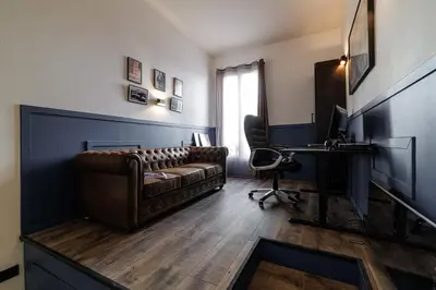 a living room with a couch and a desk at MY CASA - STALINGRAD 24 - Cosy loft - Port in Nice