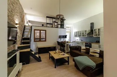 a living room with a couch and a table at MY CASA - STALINGRAD 24 - Cosy loft - Port in Nice