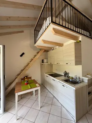 a kitchen with a sink and a staircase at Apartment duplex in Eze sur Mer in Èze