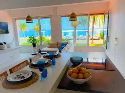 a living room with a table with fruit on it at Les pieds dans l eau in Nice