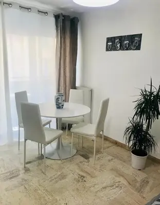 a bedroom with a bed and a picture on the wall at 3 pièces calme 5 mn Port in Nice