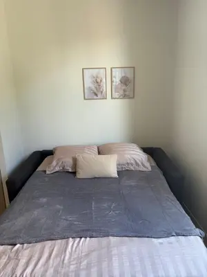 a bed with two pillows on it in a bedroom at Studio cosy Le Vismara in Nice