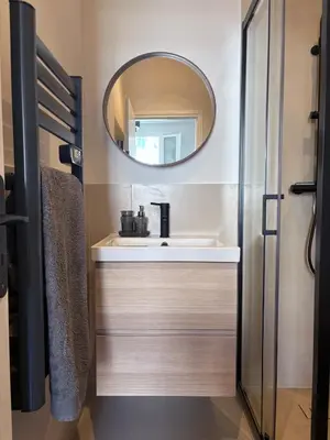a bathroom with a sink and a mirror at Studio cosy Le Vismara in Nice