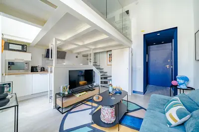 a living room with a couch and a table at Loft hyper-centre de Nice in Nice