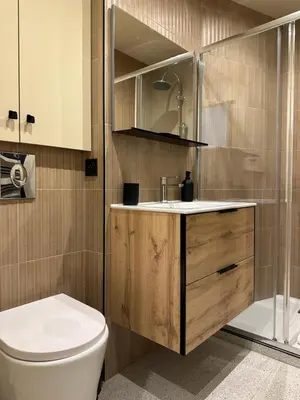 a bathroom with a toilet and a sink and a shower at Côté Mer - Élégant 3 pièces, Wifi et climatisation in Nice