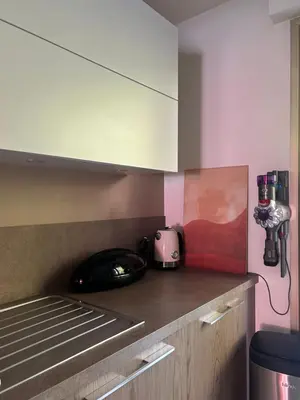 a kitchen with a counter with a phone and a toaster at Magnifique appartement - Vue mer in Nice