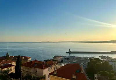 a view of a large body of water with a boat at Magnifique appartement - Vue mer in Nice