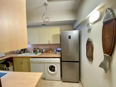 a kitchen with a refrigerator and a washing machine at NICE 2P Panoramic Sea View Wi-Fi AC in Nice