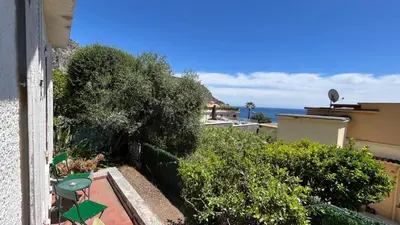 a balcony with a view of the ocean from a house at Petite Villa Eze Bord de Mer in Èze