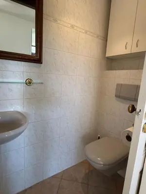 a bathroom with a toilet and a sink at Cozy Villa Saint-Jean-Cap-Ferrat in Saint-Jean-Cap-Ferrat