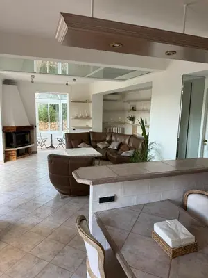 a living room with a couch and a table at Cozy Villa Saint-Jean-Cap-Ferrat in Saint-Jean-Cap-Ferrat