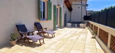 a patio with two chairs on a building at Sunset Villa atypical with air conditioning in Nice