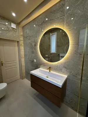 a bathroom with a sink and a mirror at Le Petit Palace in Nice