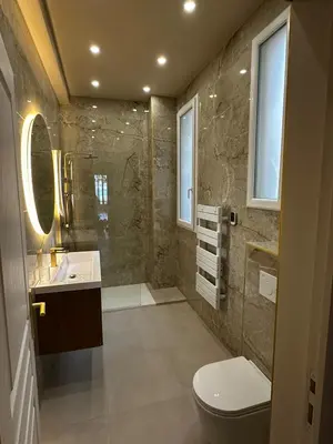 a bathroom with a shower and a toilet and a sink at Le Petit Palace in Nice