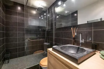 a bathroom with a sink and a shower and a toilet at 