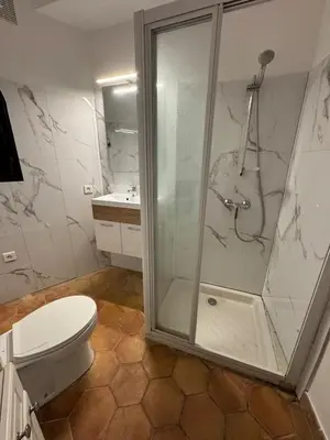 a bathroom with a shower and a toilet at Maison Lou in Falicon