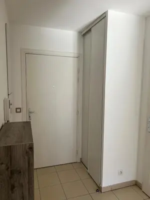an empty room with a sliding door in a building at Nice 2P quiet, tram, convenient in Nice