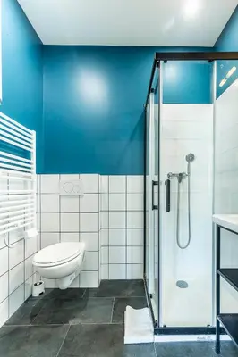 a bathroom with a toilet and a glass shower at Villa Maska - Studios avec Terrasse proche plage et aéroport de Nice in Nice