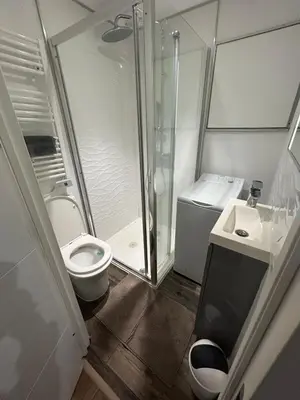 a bathroom with a shower and a toilet and a sink at Studio Masséna Nice in Nice