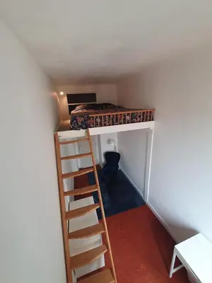 a bedroom with a bunk bed and a ladder at Superbe appartement niçois in Nice