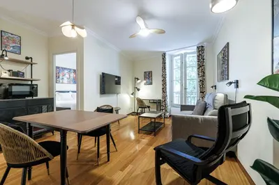 a living room with a table and chairs and a couch at Ultra Central 1 Bdr Air-Conditionned in Nice