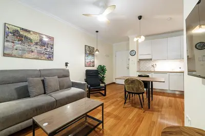 a living room with a couch and a table at Ultra Central 1 Bdr Air-Conditionned in Nice