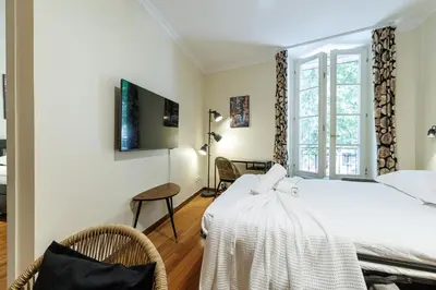 a bedroom with a white bed and a window at Ultra Central 1 Bdr Air-Conditionned in Nice