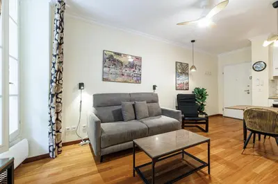 a living room with a couch and a table at Ultra Central 1 Bdr Air-Conditionned in Nice