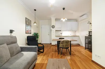 a living room with a couch and a table at Ultra Central 1 Bdr Air-Conditionned in Nice