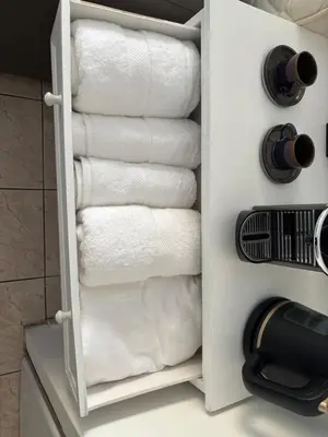 a rack of towels in a bathroom at Cœur de Nice - Plage à 5min in Nice