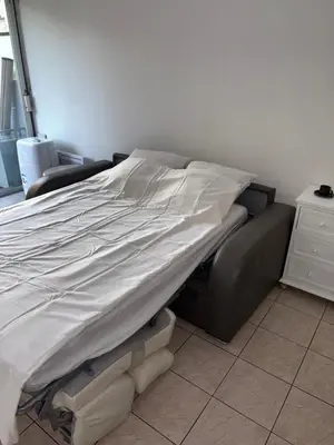 a bed sitting in a room with a bed frame at Cœur de Nice - Plage à 5min in Nice
